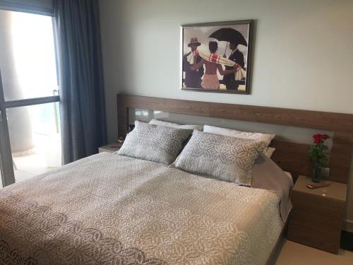 a bedroom with a bed and a picture on the wall at Apartment Vista Bella in Calpe