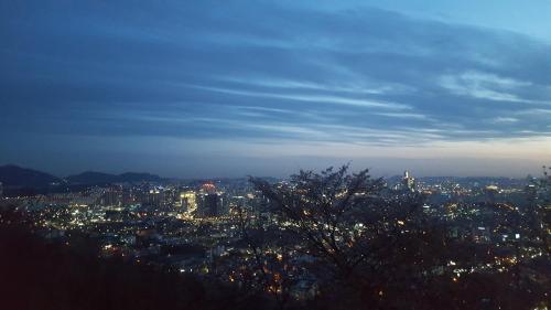 a view of a city at night at Seoul Forest Stay in Seoul