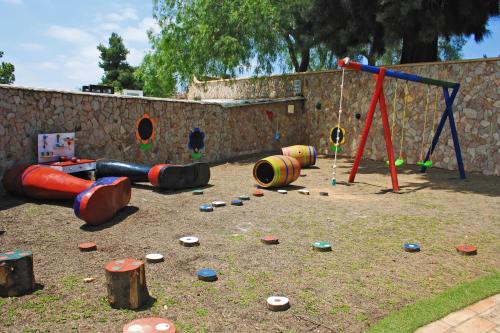 a playground set up for children to play in at Quinta dos Vales Wine Estate in Estômbar