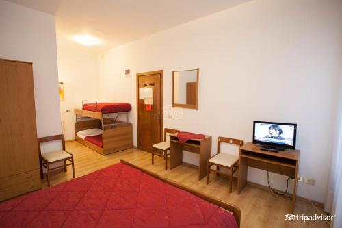 Postel nebo postele na pokoji v ubytování Hotel Caprera
