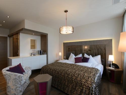 a bedroom with a large bed with a cheetah bedspread at Hotel-Restaurant-Schifflände in Birrwil
