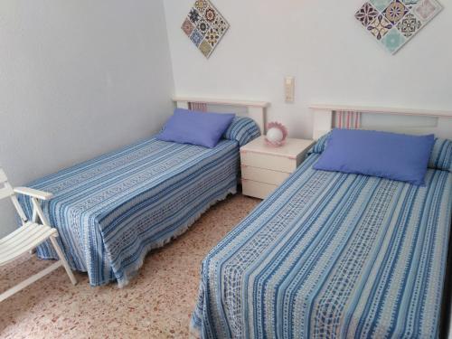 Posteľ alebo postele v izbe v ubytovaní Apartamento Parque playa