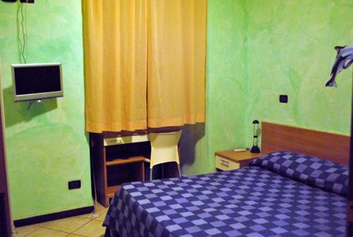 Кровать или кровати в номере Hotel Acquario