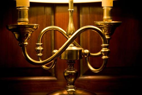 a close up of a gold candle holder at 23 Mayfield in Edinburgh