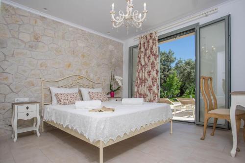 A bed or beds in a room at Alexandros Stone House