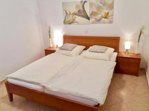 a bedroom with two beds and two night stands at Villa Skoric in Orebić