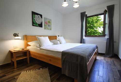 Кровать или кровати в номере Lagom Apartments