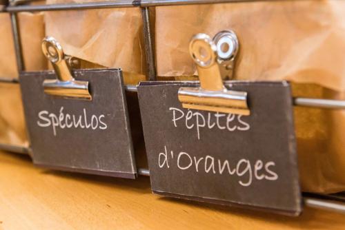 two signs with the words perils and outcomes at Ibis Château-Thierry in Essômes-sur-Marne