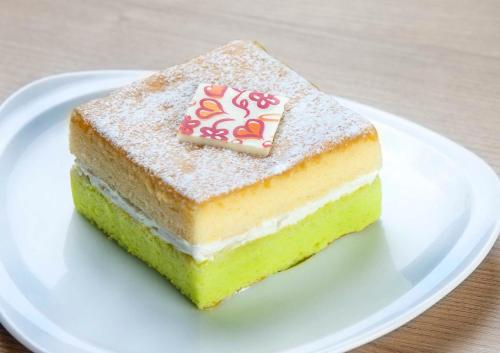 a piece of cake on a white plate at The Now Hotel - SHA Extra Plus in Jomtien Beach