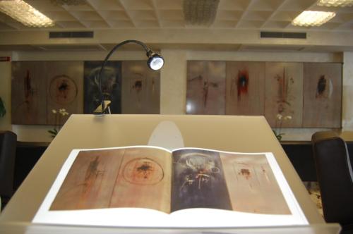 a book sitting on top of a table at Grand Hotel Moroni in Finale Ligure