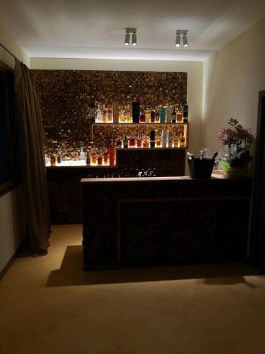 a bar in a room with a brick wall at Locanda Sensi in Rivergaro