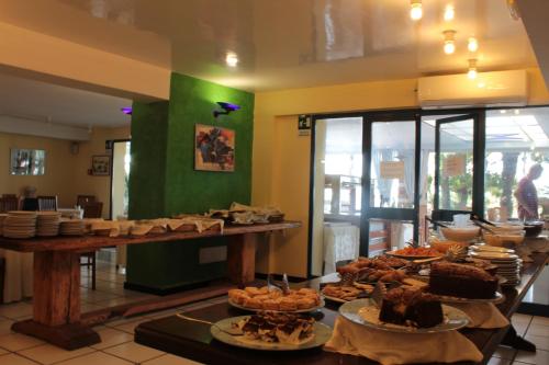 a buffet line with many different types of food at Hotel Nike in Giardini Naxos