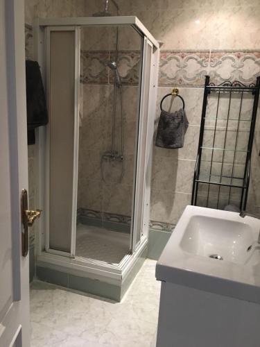 a bathroom with a shower and a sink at Malvarrosa Calle Pavia in Valencia
