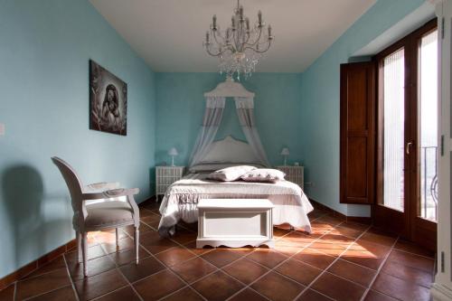 A bed or beds in a room at La Rossa Fantastica