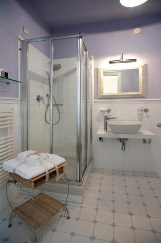a bathroom with a shower and a sink at Corte Gondina Boutique Hotel in La Morra