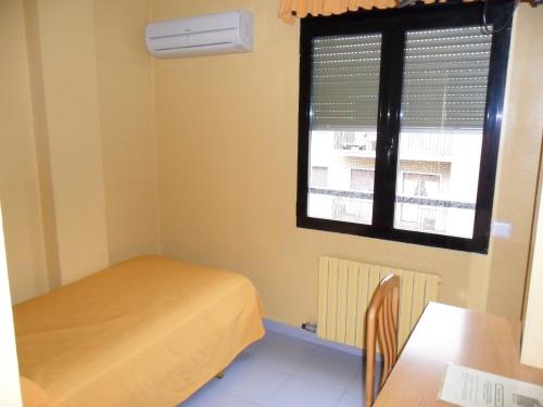 Letto o letti in una camera di Hotel Delicias