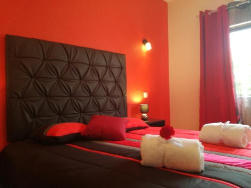 Ένα ή περισσότερα κρεβάτια σε δωμάτιο στο Sensations Guesthouse