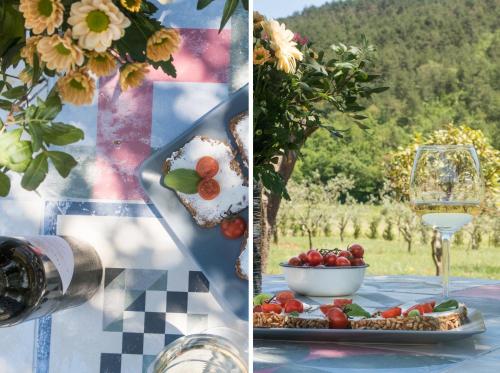 a table with a plate of food and a glass of wine at Villa Terra in Labin