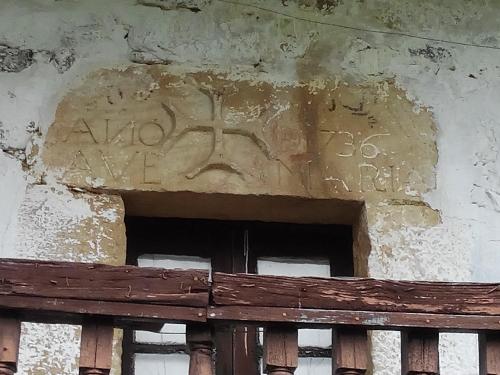 a stone carving on the wall of a building at Posada Montero de la Concha in Esles