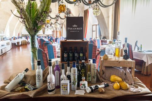 a table with bottles of wine on a table at Parador de Jaén in Jaén