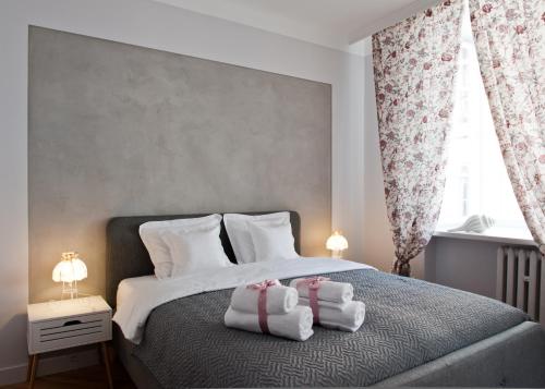 Posteľ alebo postele v izbe v ubytovaní Red Brick Old Town Apartment