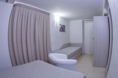 Un pat sau paturi într-o cameră la Residence Agave Lampedusa