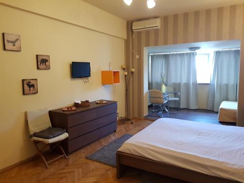 Un pat sau paturi într-o cameră la Hospitality Centrum - Magheru