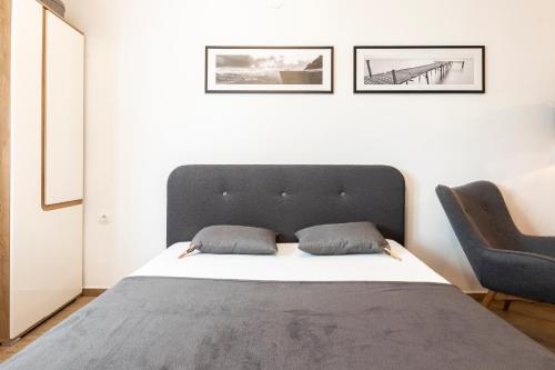 Ένα ή περισσότερα κρεβάτια σε δωμάτιο στο studio11 apartments MIST -tomšičeva 3