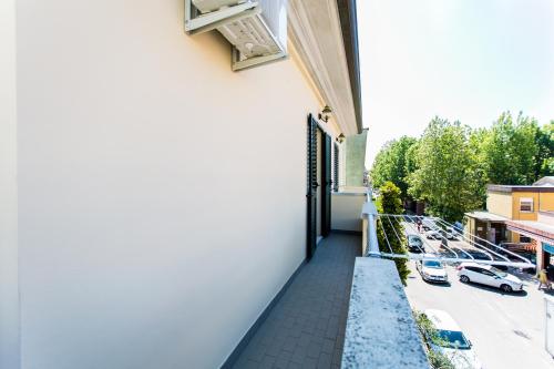 a balcony with a view of a parking lot at Residence Kimba in Rimini