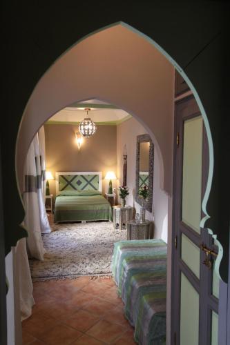 Llit o llits en una habitació de Riad Karmela