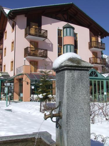 a water fountain in front of a building at Club Hotel Tenno in Tenno