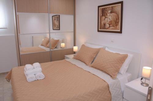 Posteľ alebo postele v izbe v ubytovaní Keratea Apartment Athens Airport