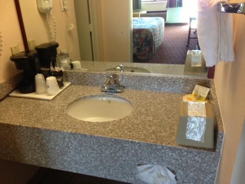 a bathroom counter with a sink in a hotel room at Days Inn by Wyndham Santa Fe New Mexico in Santa Fe