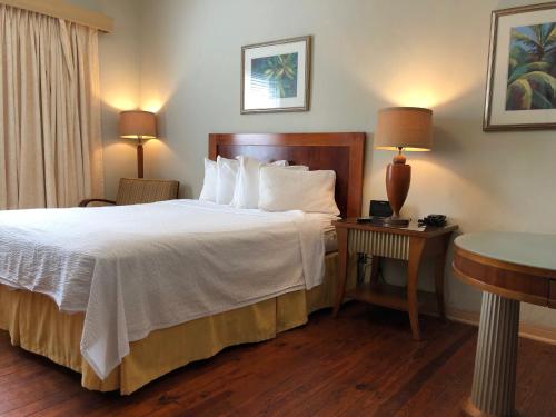 a hotel room with a bed and a table at Viscay Hotel in Miami Beach