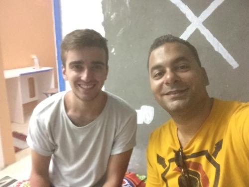 two men are sitting next to each other at david hostel in Aswan