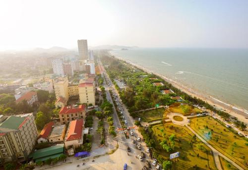 an aerial view of a city and the ocean at Thanh Tu Hotel in Cửa Lò
