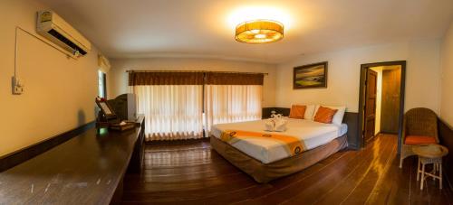 Posteľ alebo postele v izbe v ubytovaní Inrawadee Resort