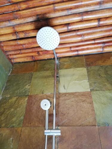 a stool in the middle of a room with a ceiling at Coco Country Homes in Melaka