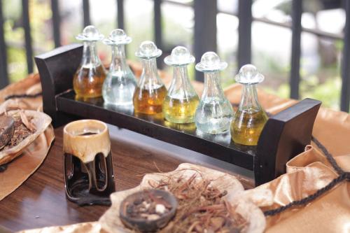 a group of bottles sitting on top of a table at Metland Hotel Bekasi in Bekasi