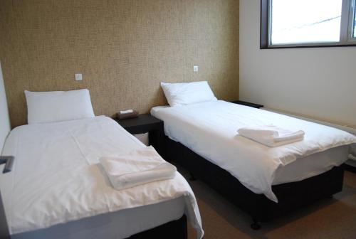 Cama o camas de una habitación en Neyuki Townhouse