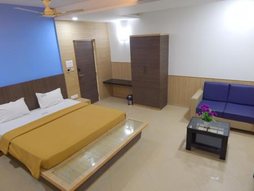 Cama o camas de una habitación en Hotel Aadhi