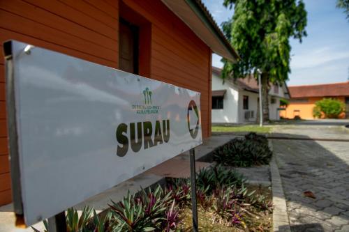 a sign in front of a house at De Palma Resort Kuala Selangor in Kuala Selangor