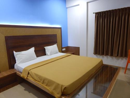 Cama o camas de una habitación en Hotel Aadhi