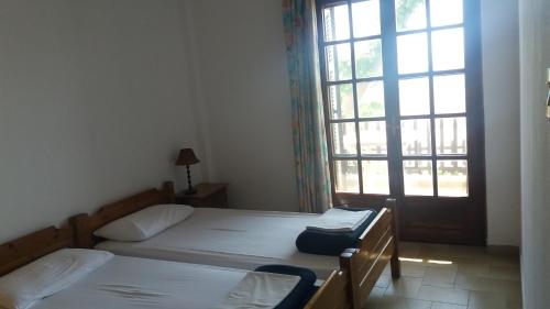 Katil atau katil-katil dalam bilik di House Kosmas on the beach