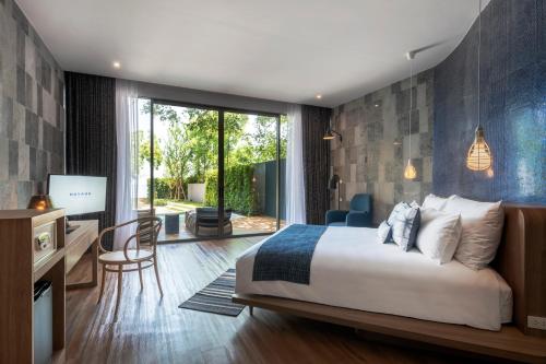Katil atau katil-katil dalam bilik di Navana Nature Escape - SHA Extra Plus