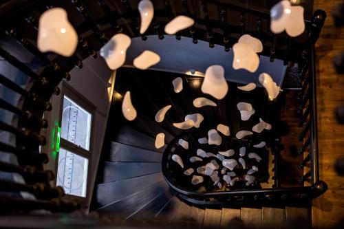 a room with a bunch of mushrooms hanging from a wall at Gambello Luxury Rooms in Nafplio