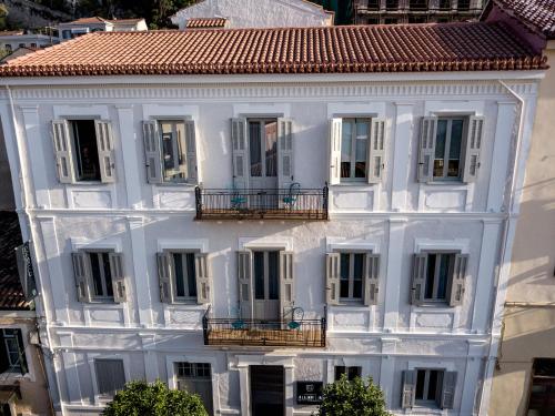 an aerial view of a white building with a red roof at Gambello Luxury Rooms in Nafplio