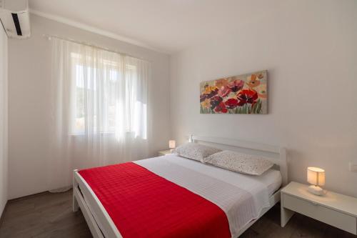 Postel nebo postele na pokoji v ubytování Green Paradise Apartments