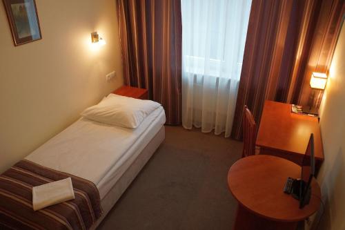 Postel nebo postele na pokoji v ubytování Hotel BOSiR