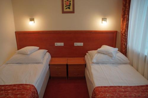 Postel nebo postele na pokoji v ubytování Hotel BOSiR